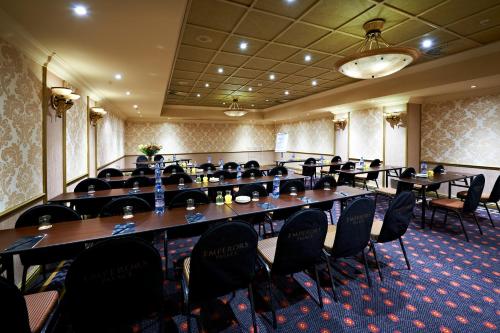 a large room with tables and chairs in it at Peermont D'oreale Grande at Emperors Palace in Kempton Park