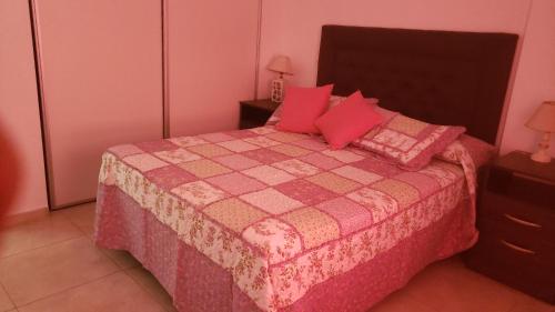 Ένα ή περισσότερα κρεβάτια σε δωμάτιο στο Colón