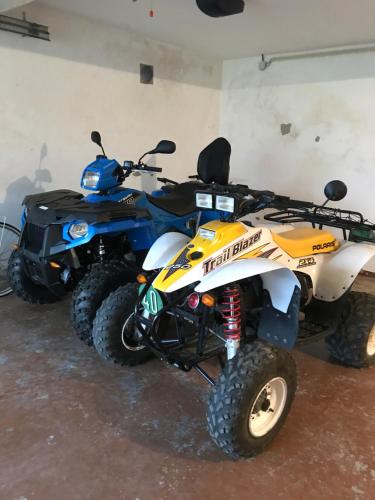 a atv parked inside of a garage with at Casa do eirô in Resende