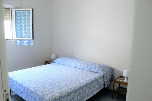 Postel nebo postele na pokoji v ubytování villino sabbia d'oro