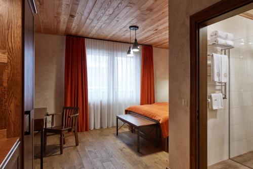Ένα ή περισσότερα κρεβάτια σε δωμάτιο στο Ganz & SPA