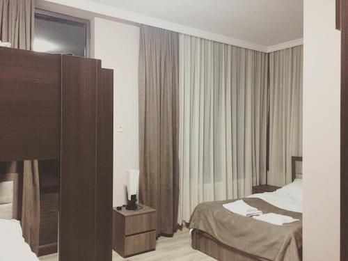 Postel nebo postele na pokoji v ubytování Tradition Hotel