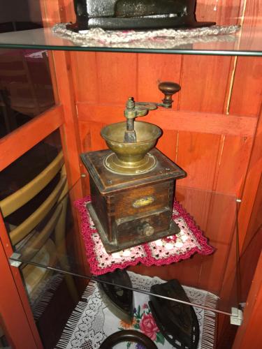 an old water fountain sitting on top of a glass table at Penzión Príjemný Oddych in Banská Štiavnica