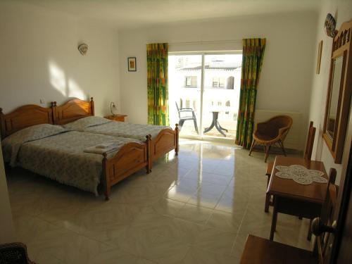 Cama o camas de una habitación en Vila Bushiribana - Vivenda Johanna