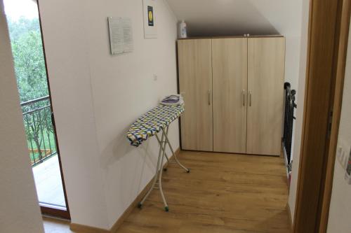 a room with a hallway with a desk and a cabinet at Oasis of peace in Bihać