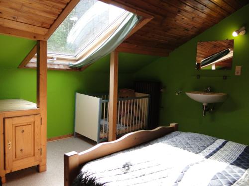เตียงในห้องที่ Chambres d'hôtes des Ardennes