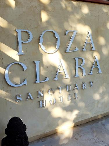 a sign for a baraya ordinary hospital at Poza Clara Sanctuary in Bacalar