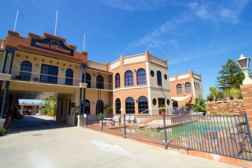 a building with a fence in front of it at Albury Paddlesteamer in Albury