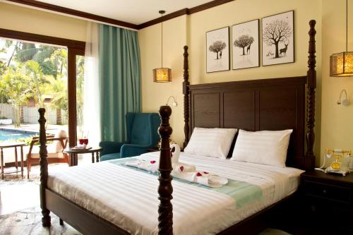 a bedroom with a bed and a pool at Sunrise Garden House - Luang Prabang in Luang Prabang