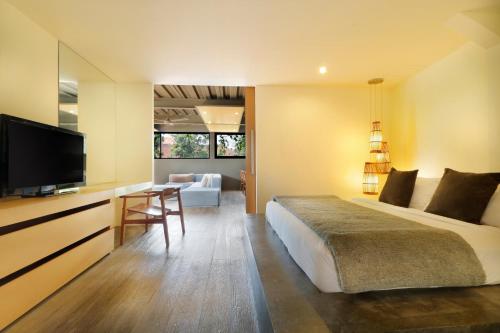 מיטה או מיטות בחדר ב-Clio Apartment