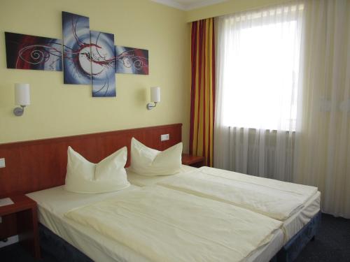Katil atau katil-katil dalam bilik di Park Hotel Rüdesheim