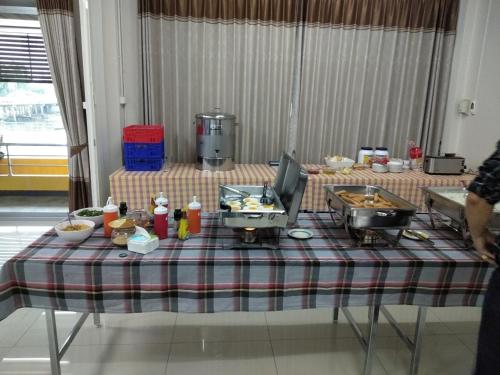 a table with food on top of it at Amatara Hotel in Pi Mai