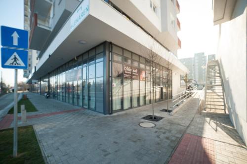 a building with glass windows on the side of it at After Eight Apartment in Bratislava
