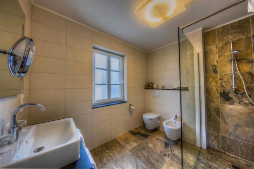 a bathroom with a sink and a toilet at Villa Beilstein in Beilstein