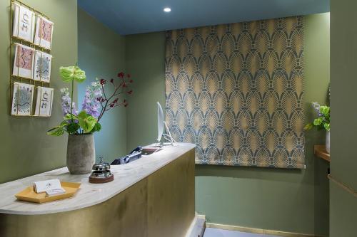 a office with a desk with a computer on it at Condominio Monti Boutique Hotel in Rome