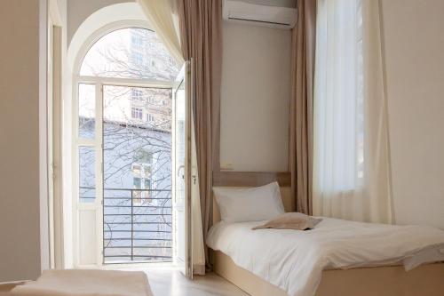 Postel nebo postele na pokoji v ubytování Hotel Casa calda