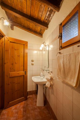 a bathroom with a sink and a mirror at Villa Palaios Agios Athanasios in Palaios Agios Athanasios