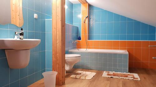 a bathroom with a toilet and a sink at Stará Lesná ADEX in Stará Lesná