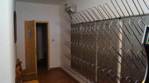 a hallway with a metal wall in a room at Hotel Schwarzbachhof in Lutago