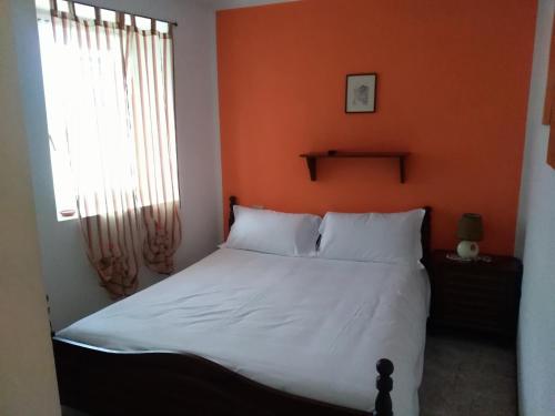 Una cama o camas en una habitación de albergo ristorante coppa