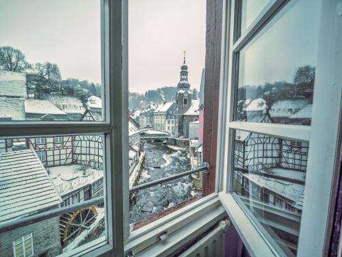a view of a city from a window at Haus Stehlings in Monschau