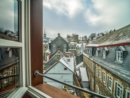 a view of a city from a window at Haus Stehlings in Monschau