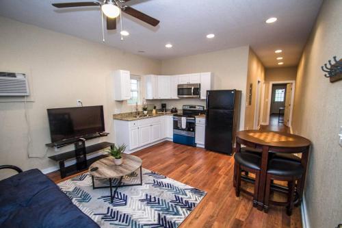 a living room with a couch and a kitchen at Hackberry St #A Renovated 2BR/2BA Near Downtown in San Antonio