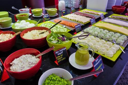 a table topped with lots of different types of food at ibis Styles Bielsko Biala in Bielsko-Biała
