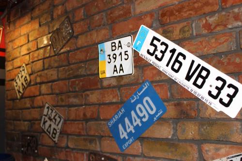 a brick wall with street signs on it at Biker's Pub in Oleksandriya