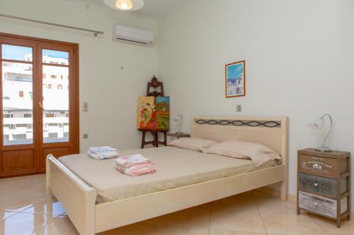 Postel nebo postele na pokoji v ubytování Like Home Naxos