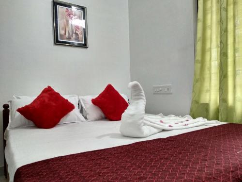 Ένα ή περισσότερα κρεβάτια σε δωμάτιο στο Blue Birds Homestay