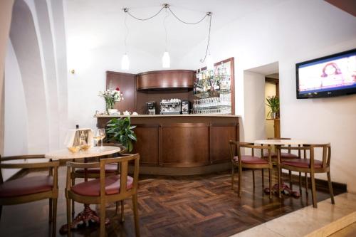 a restaurant with two tables and a bar at Grand Hotel Italia in Orvieto