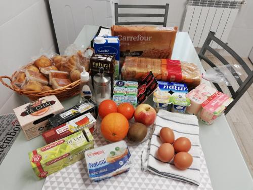 a table with a bunch of food on it at Apartamento Campillín in Oviedo
