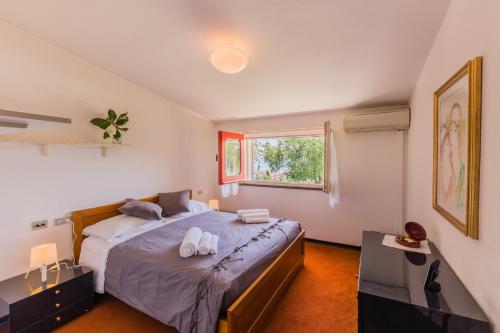 A bed or beds in a room at Villa Claudia