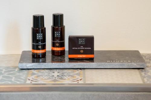 two bottles of essential oils sitting on a counter at Boutique Hotel Marielle in Bad Münstereifel