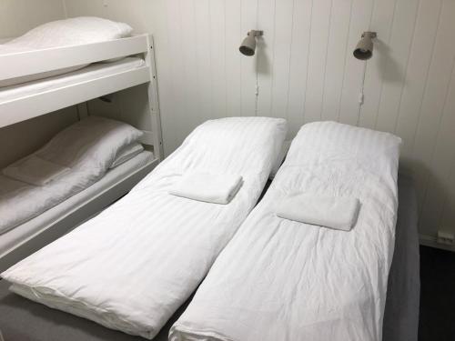 Katil atau katil-katil dalam bilik di Vinstra Hostel