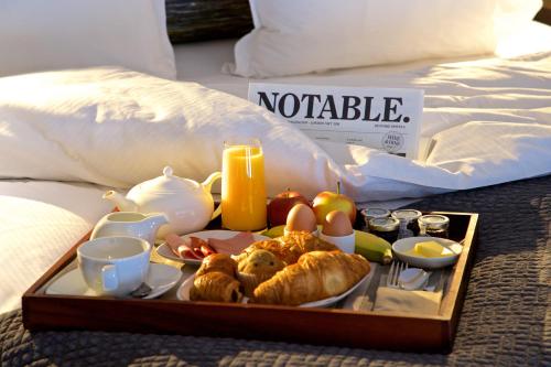 a tray of food on a table at 54 Queen's Gate Hotel in London