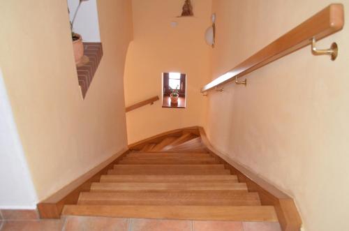 a staircase in a house with wooden floors at Apartmany A.Ša Kašperské Hory in Kašperské Hory