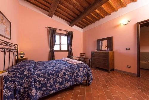 Postel nebo postele na pokoji v ubytování Agriturismo Pratovalle