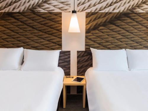 Ein Bett oder Betten in einem Zimmer der Unterkunft Ibis Torreon