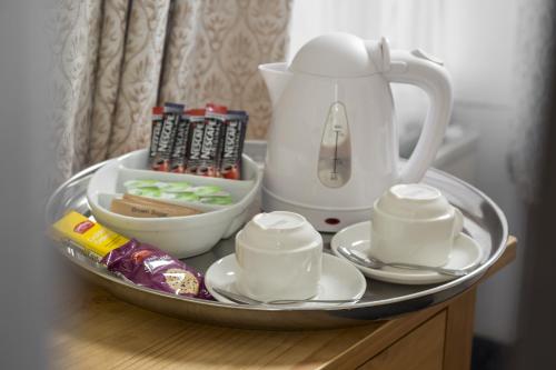 a tray with a tea kettle on a table at Lobster Hall - Room Only in Whitby