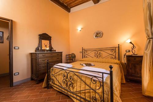 Postel nebo postele na pokoji v ubytování Agriturismo Pratovalle