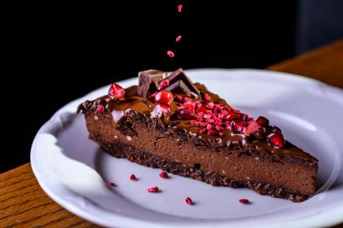 a piece of chocolate cake on a white plate at BS-Ötscher Hotel in Lackenhof