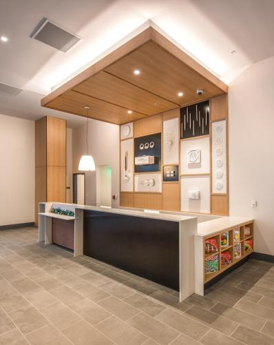 a large kitchen with a counter in a room at Hyatt House Nashville at Vanderbilt in Nashville