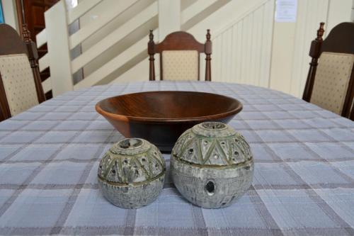 two vases sitting on top of a table at Nine-ohh Skuitbaai in Eersterivierstrand