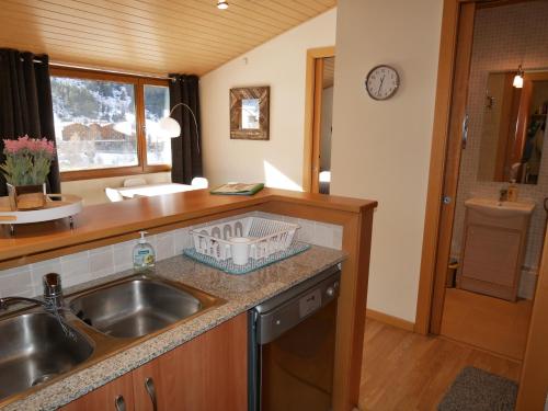a kitchen with a sink and a counter top at Sol Tarter - Vacances Pirinenca in El Tarter