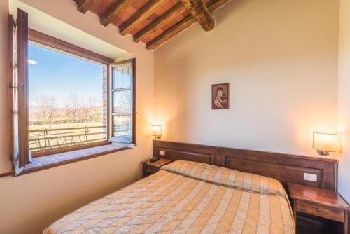 Ένα ή περισσότερα κρεβάτια σε δωμάτιο στο Antico Casale