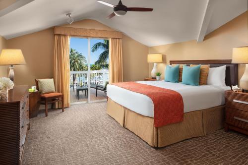 a bedroom with a large bed and a balcony at Hyatt Vacation Club at Sunset Harbor in Key West