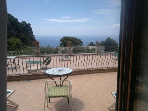 a view of a patio with a table and chairs at Hotel 4 Stagioni in Capri