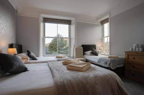 Ein Bett oder Betten in einem Zimmer der Unterkunft Lyndale Guest House